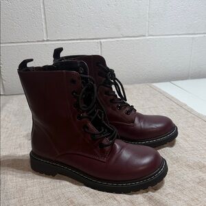Torrid Stevie Lace-Up Combat Boots in the burgundy colorway.